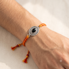 The Karuna Oval Purple Stone Rakhi
