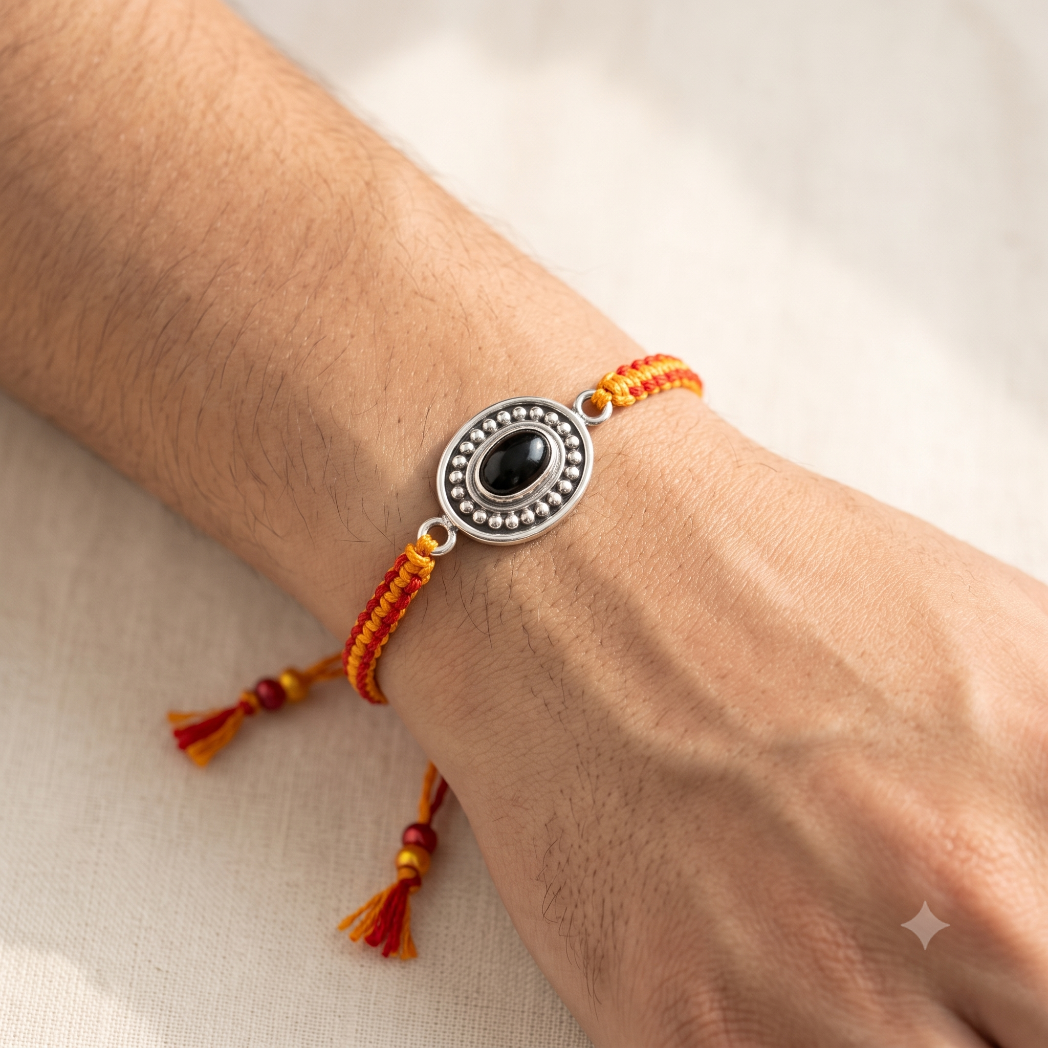 The Karuna Oval Purple Stone Rakhi